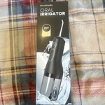 Oasismile L5 Water Flosser Black Rechargeable Cordless 4 Pressure Settings. Fixed Price $26.95.
