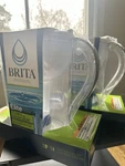 Brita 2 Large 10 Cup Water Filter Pitcher With Elite White New. Fixed Price $68.00.