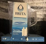 New Brita Large 10 Cup Water Filter Pitcher W/ 1 Standard - White. Fixed Price $33.33.