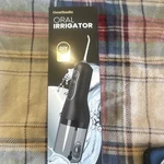 Oasismile L5 Cordless Water Flosser Black Detachable Tank 4 Modes 140 Psi. Fixed Price $20.00.